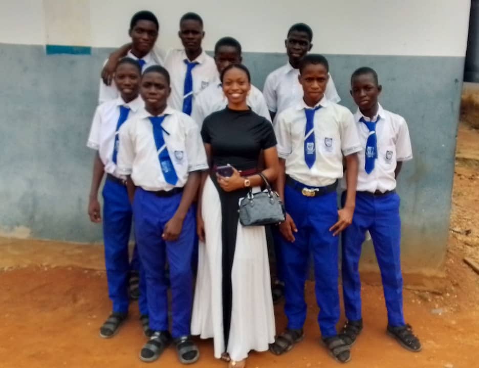 TVHI team with male students at school compound