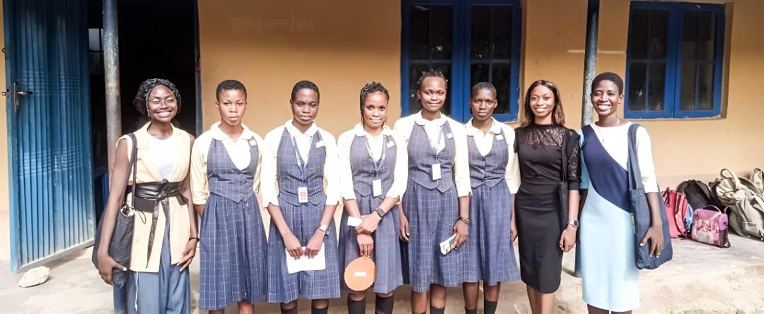 TVHI team with female students outdoors